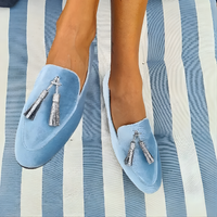 Sneaker with a silver tassel